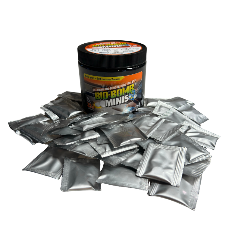 A collection of Bio-Bomb Minis cleaning and deodorizing tablets in different packaging sizes, with branding and product information visible.